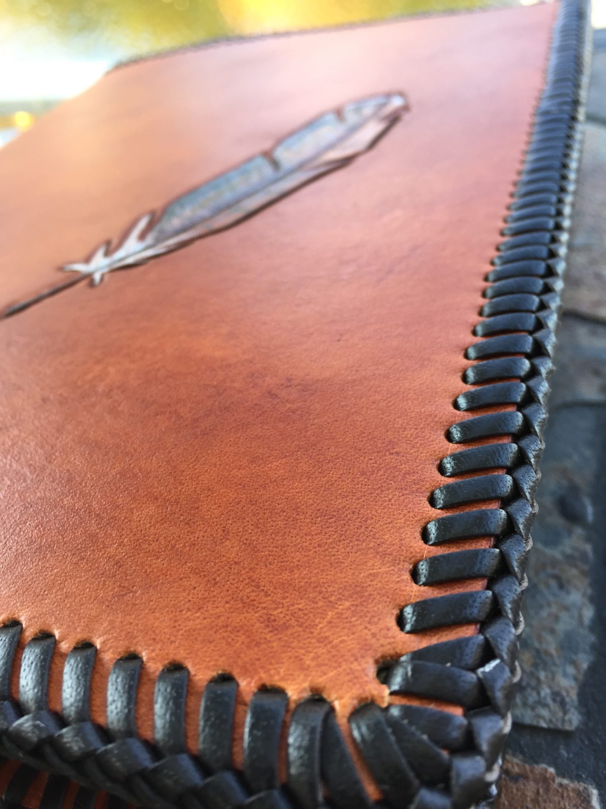 detail of leather laced edge